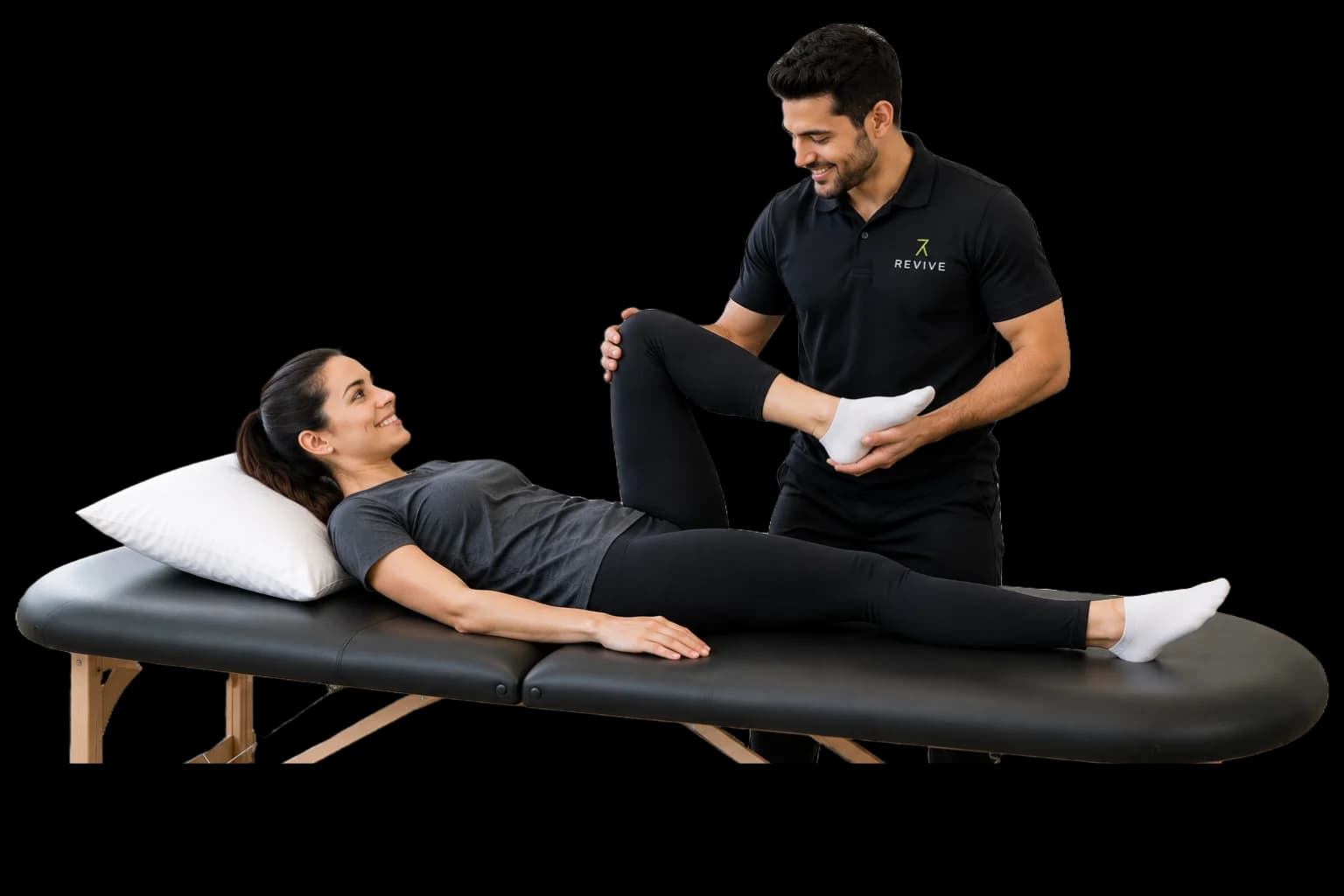 Physiotherapist stretching a patient's leg on a treatment table
